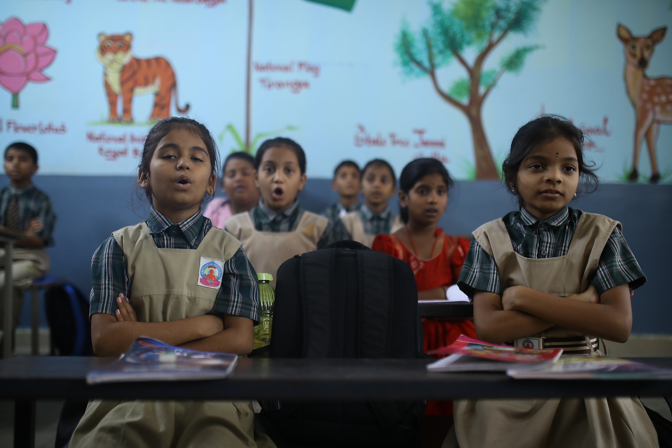 Young students in uniform seated in a Foundation classroom